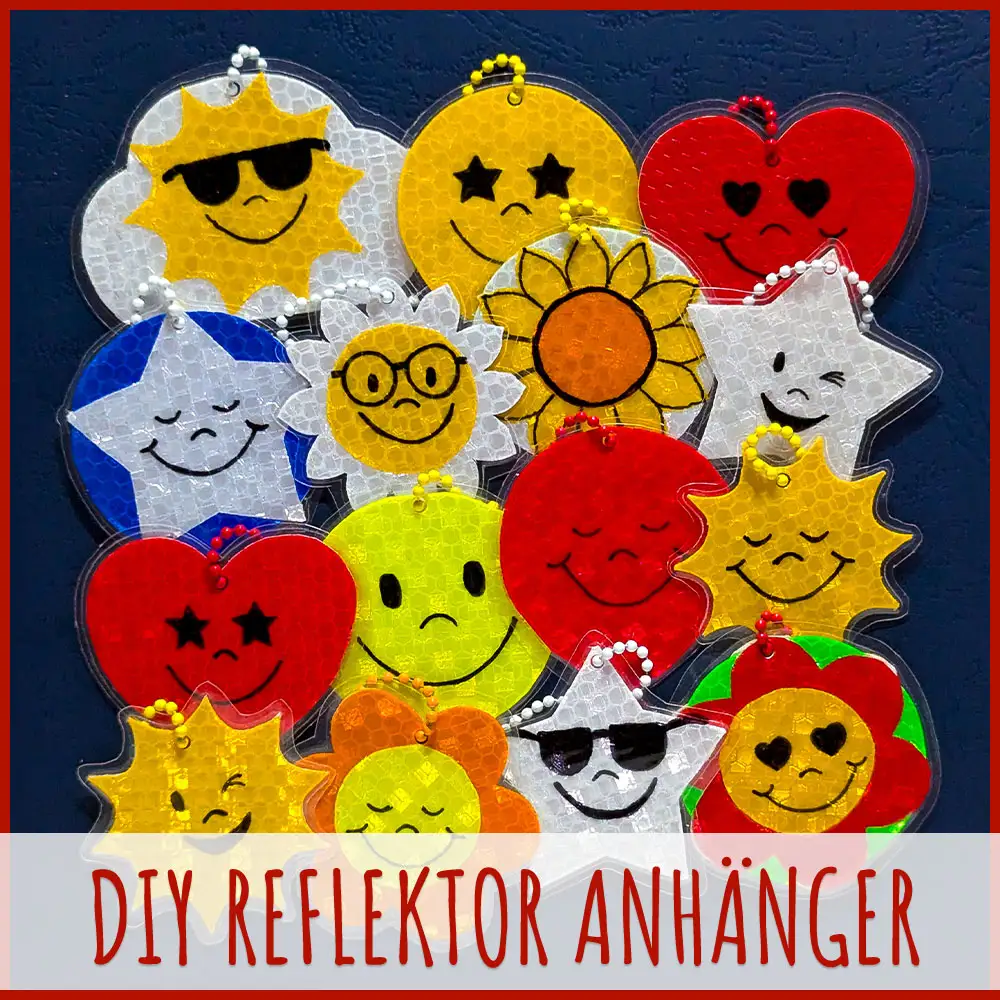 Fröhliche Anhänger aus Reflektorband Kleine bunte aus Reflektorband gebastelte fröhliche Anhänger Reflektoren für Rucksack und Taschen