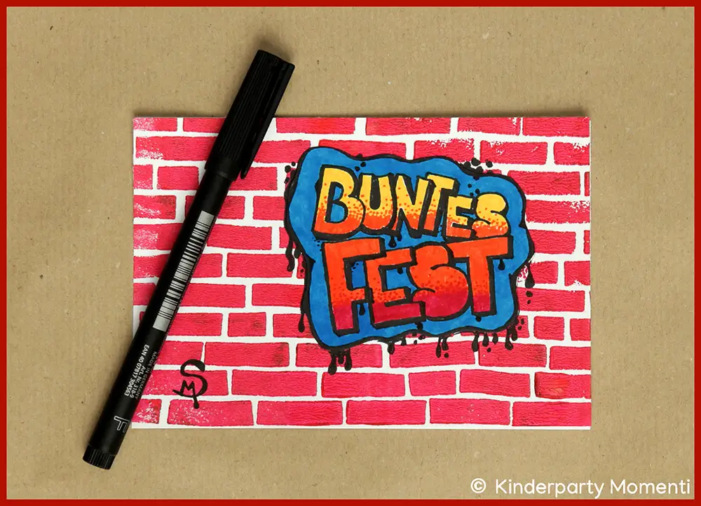 Vorlage für eine Weihnachtskarte mit rotem Ziegelmuster und Graffiti-Schriftzug 'BUNTES FEST' in Gelb, Orange und Blau, daneben schwarzer Filzstift.